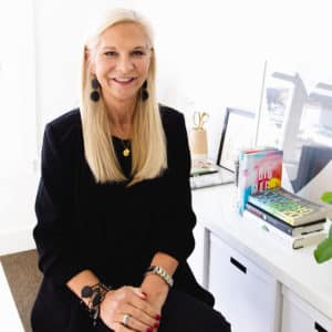 Kristin Bloomquist sitting at a desk